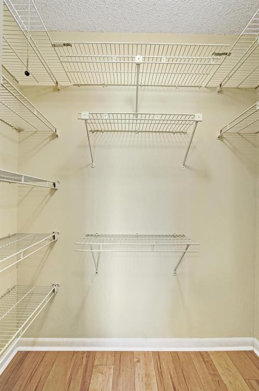 1005 Lincoln A, Unit 1005 Boca Raton, FL 33434 - Photo 18 of 33 a view of a room with racks on the wall