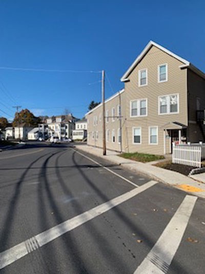 a front view of a house with a yard