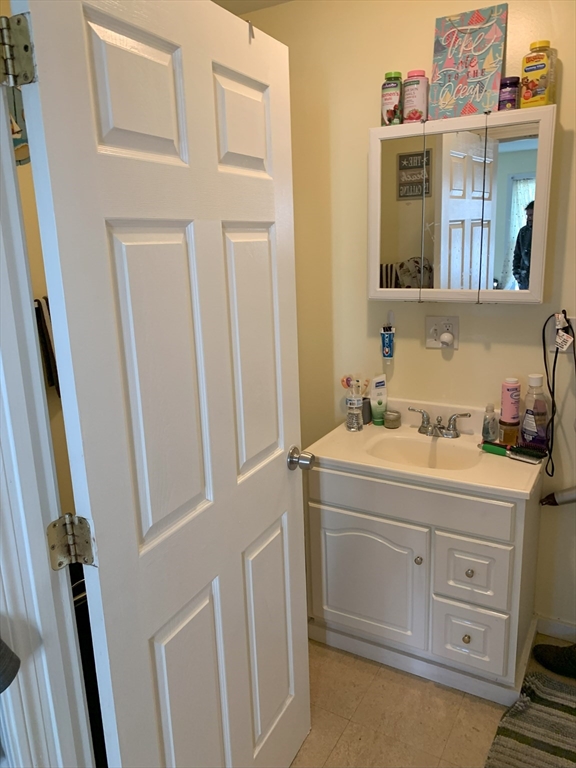 2-12 Chace Street Clinton, MA 01510 - Photo 4 of 5 a bathroom with a sink and a mirror