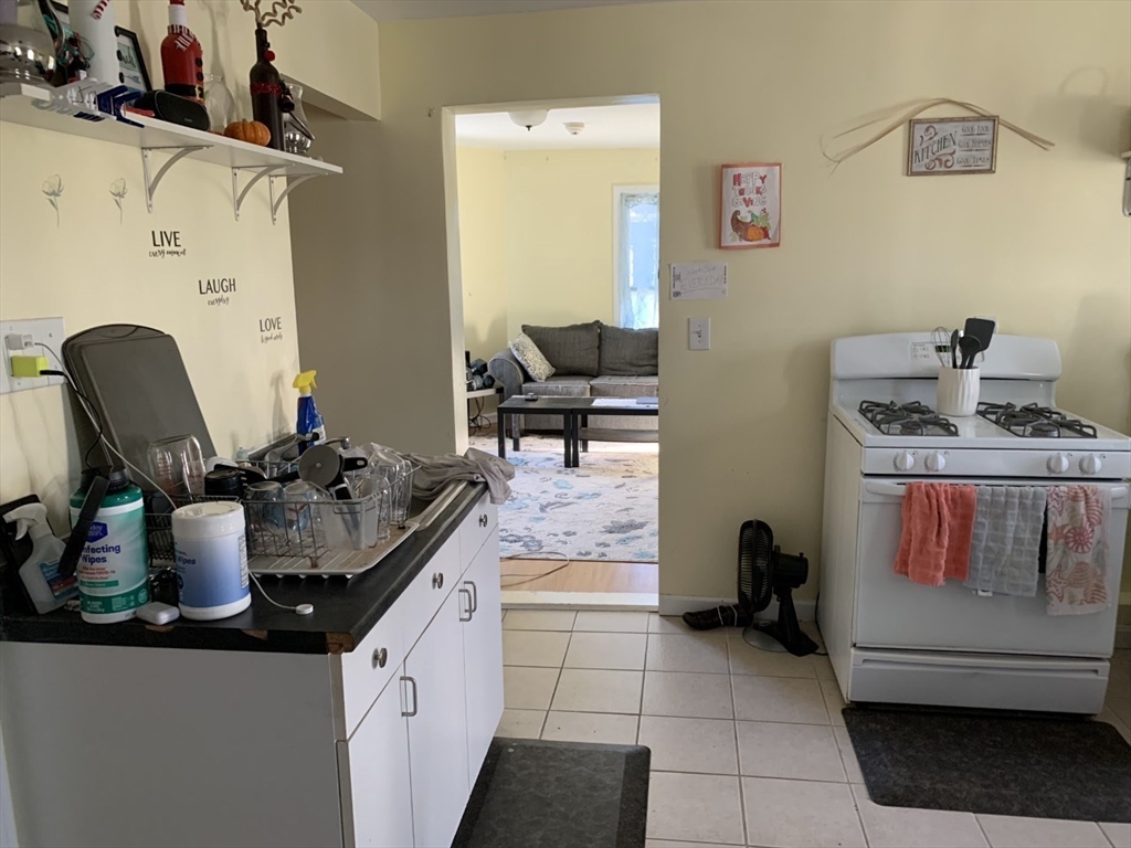 2-12 Chace Street Clinton, MA 01510 - Photo 5 of 5 a kitchen with a sink and a stove top oven
