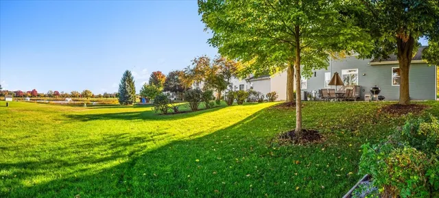a view of a house with a big yard