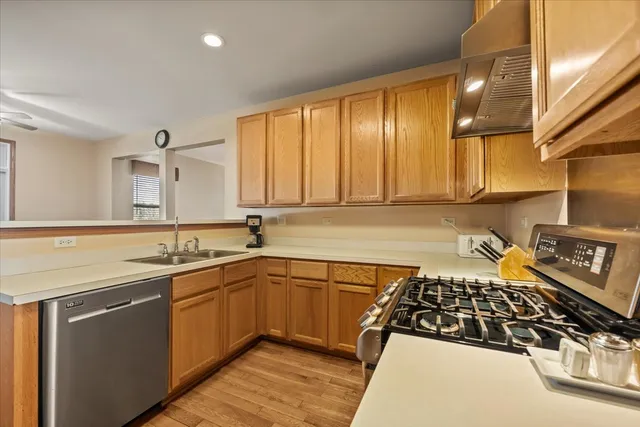 a kitchen with a sink a stove and cabinets
