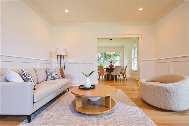 a living room with furniture and a lamp