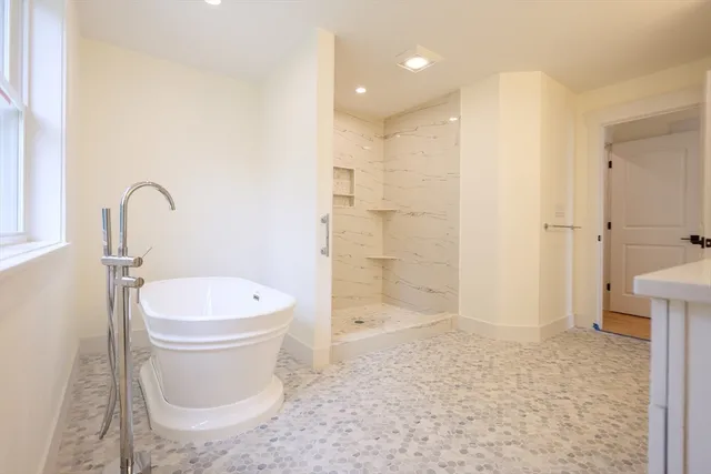 a bathroom with a toilet sink and shower