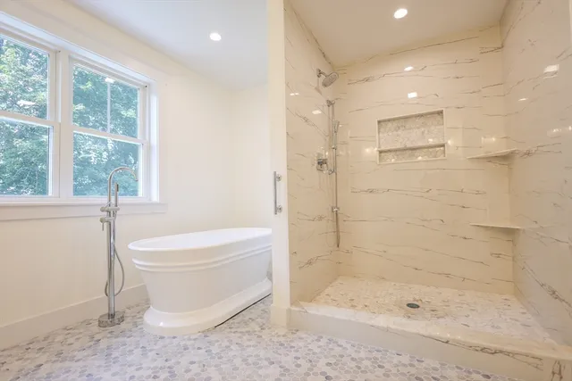 a bathroom with a toilet a sink and bathtub