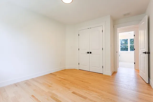 a bathroom with a double vanity sink and window