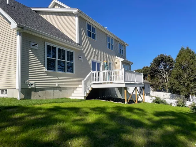 a house view with a sitting space and garden