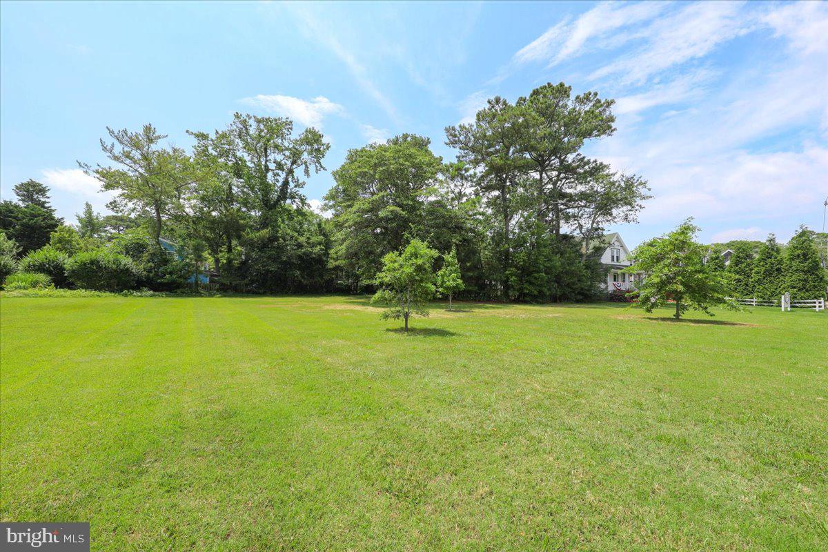 312 Garfield Parkway Bethany Beach, DE 19930 - Photo 14 of 16 a front view of a house with a yard