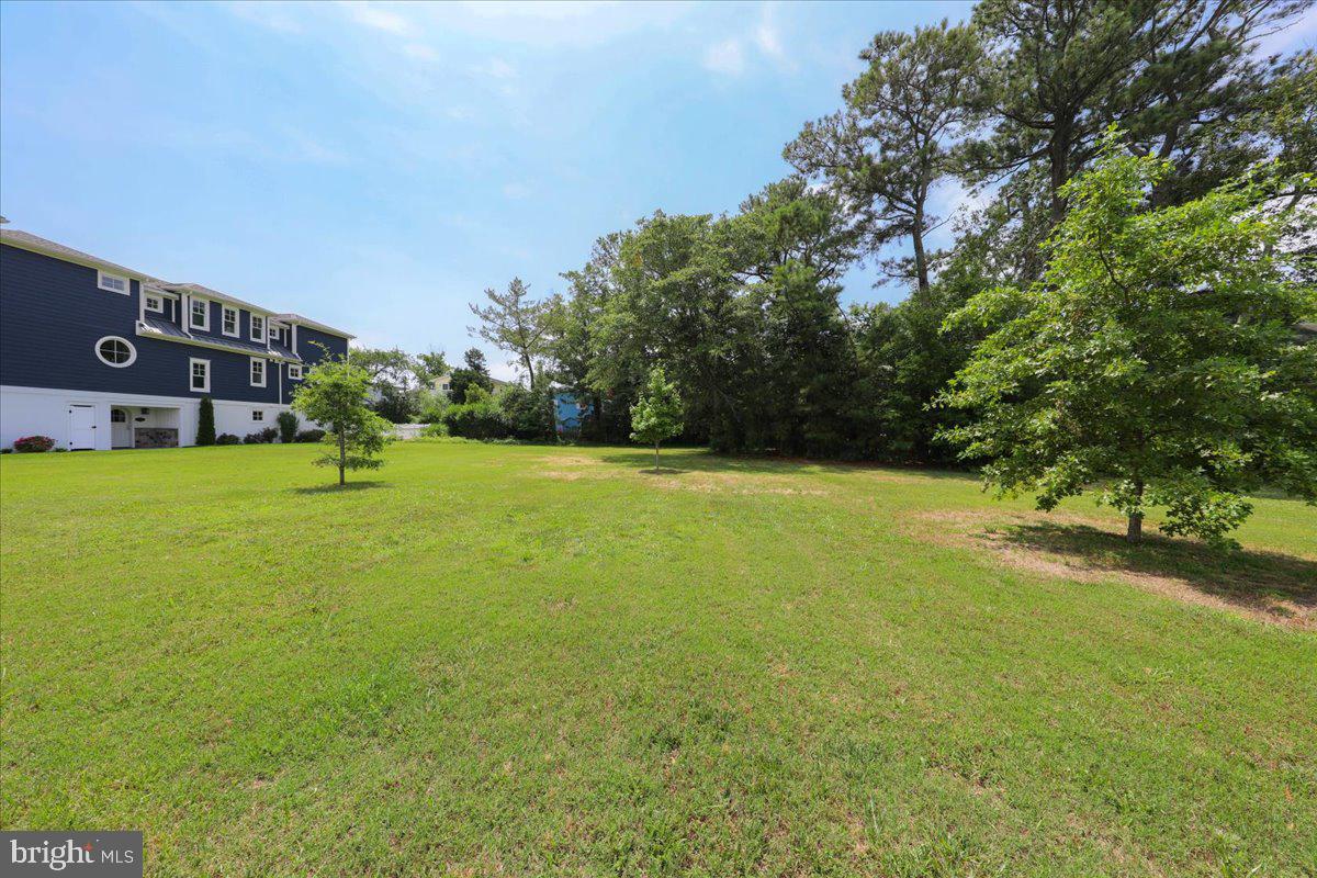 312 Garfield Parkway Bethany Beach, DE 19930 - Photo 10 of 16 a view of a field with of trees in front of it