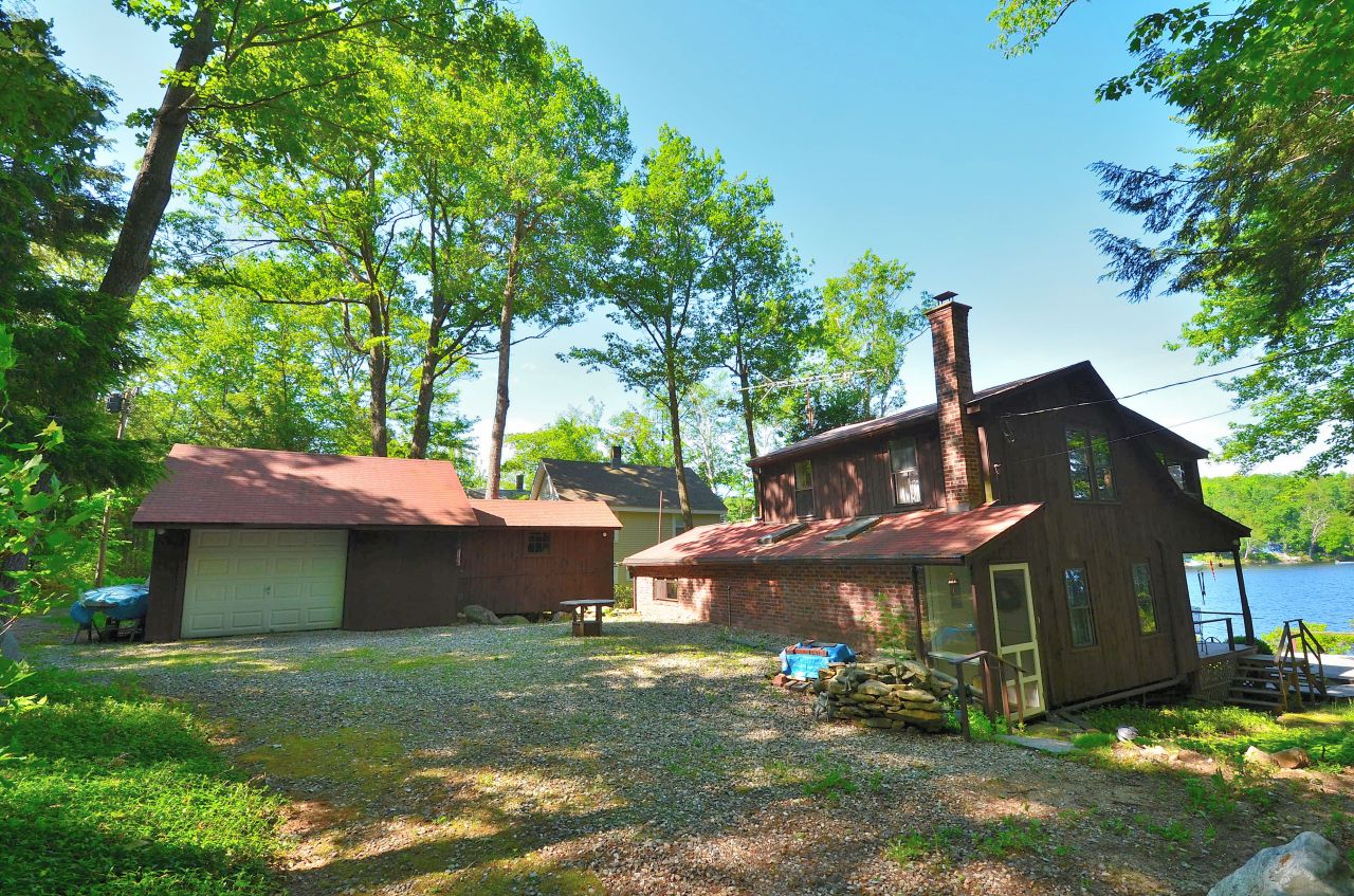88 East Shore Road Otis, MA 01029 - Photo 2 of 16 a view of a house with a yard