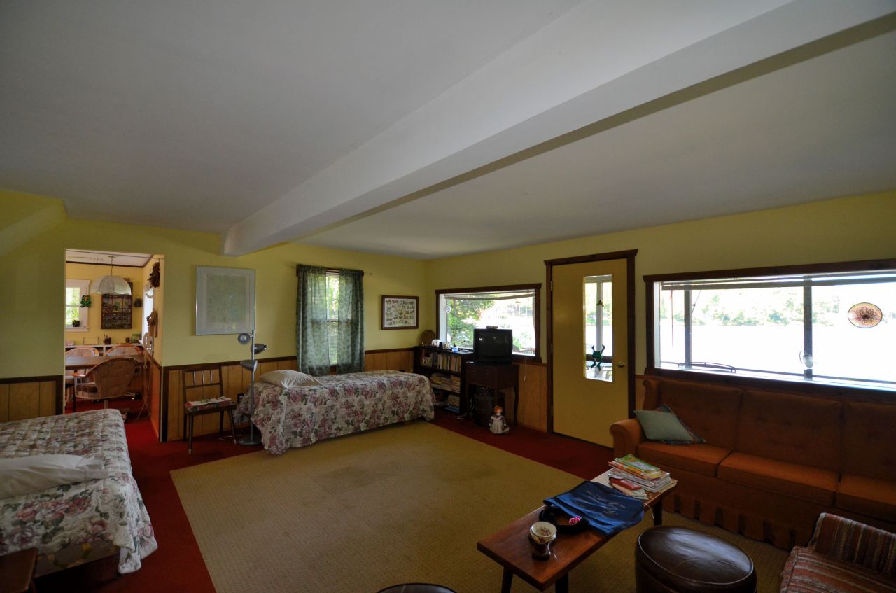 88 East Shore Road Otis, MA 01029 - Photo 11 of 16 a living room with furniture and a window