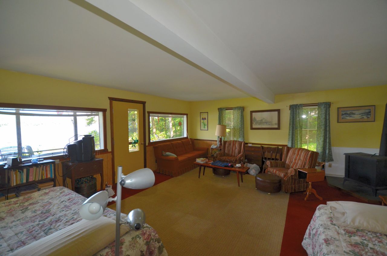 88 East Shore Road Otis, MA 01029 - Photo 12 of 16 a living room with furniture and a large window