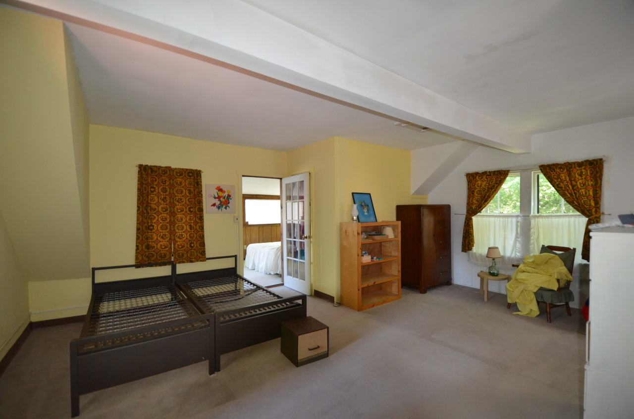 88 East Shore Road Otis, MA 01029 - Photo 13 of 16 a living room with furniture gym equipment and large window
