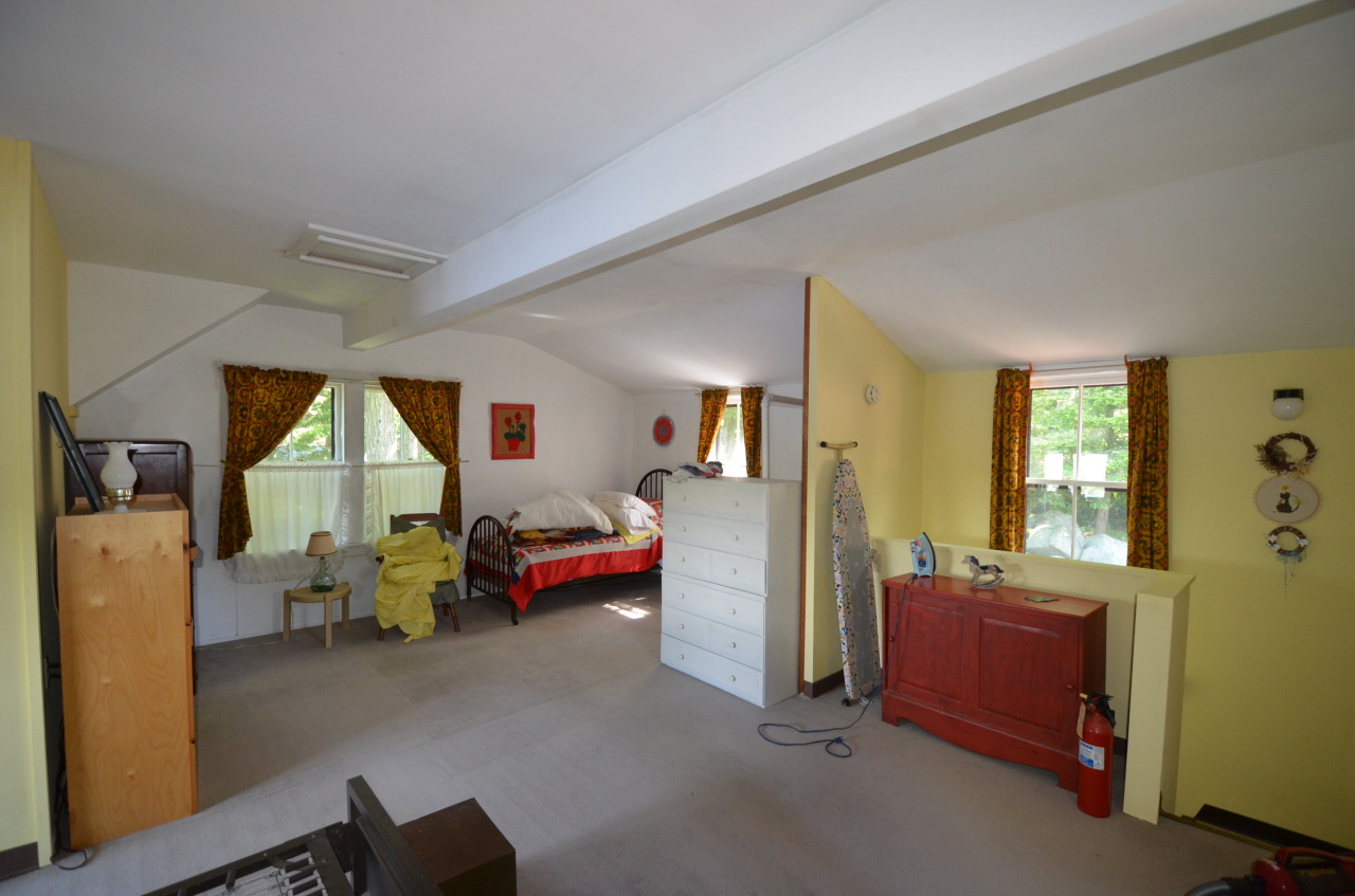 88 East Shore Road Otis, MA 01029 - Photo 15 of 16 a bedroom with furniture and a large window