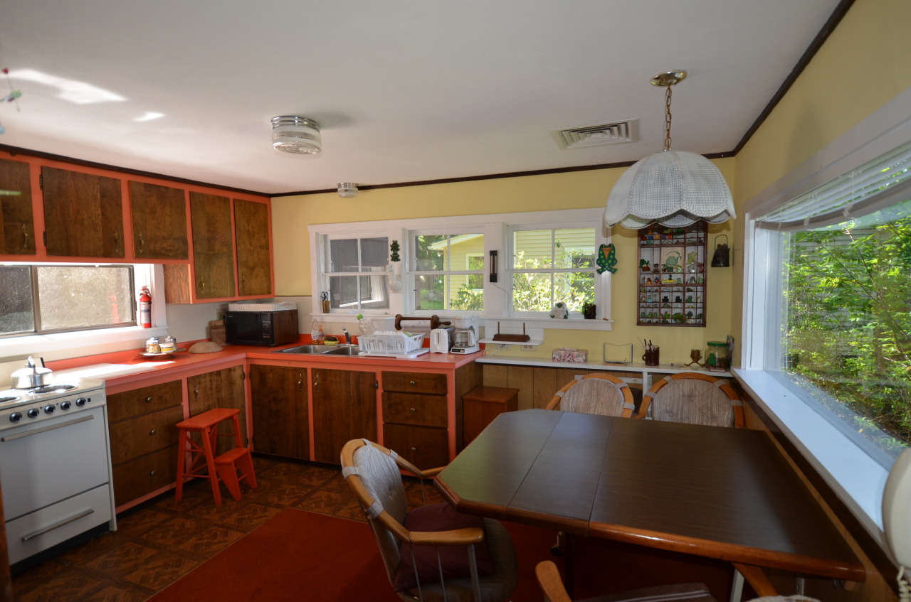 88 East Shore Road Otis, MA 01029 - Photo 10 of 16 a kitchen with stainless steel appliances granite countertop a sink a stove and a refrigerator