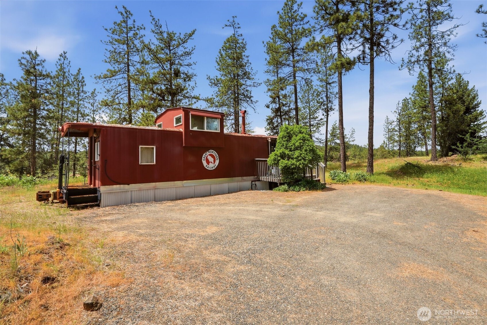 12119 South Spotted Road Cheney, WA 99004 - Photo 35 of 40 a front view of a house with a yard