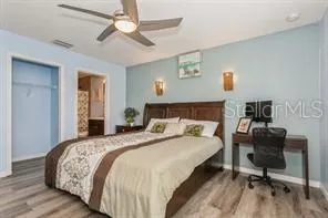 a bedroom with a bed and a chair