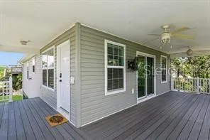 a view of a house with porch and wooden floor