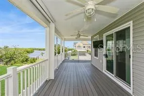 a view of a porch and garden