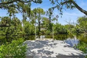 a view of lake with a yard