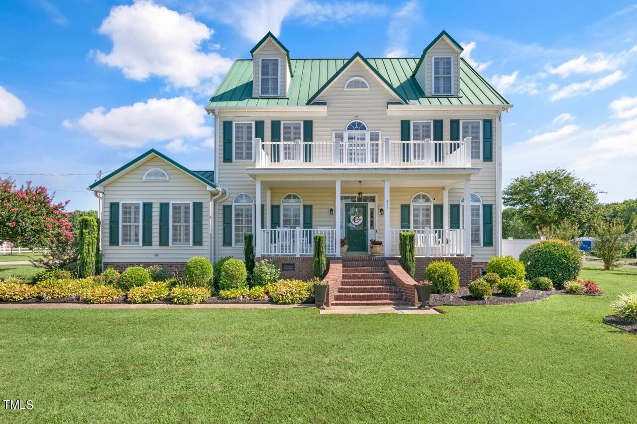 4355 Highway 264 Alternate Wilson, NC 27893 - Photo 1 of 41 a front view of house with yard and green space