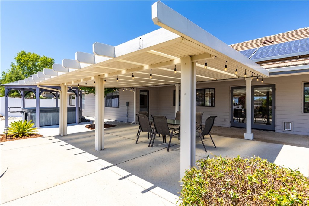 1275 Shane Lane Templeton, CA 93465 - Photo 52 of 70 a view of a patio with table and chairs under an umbrellas