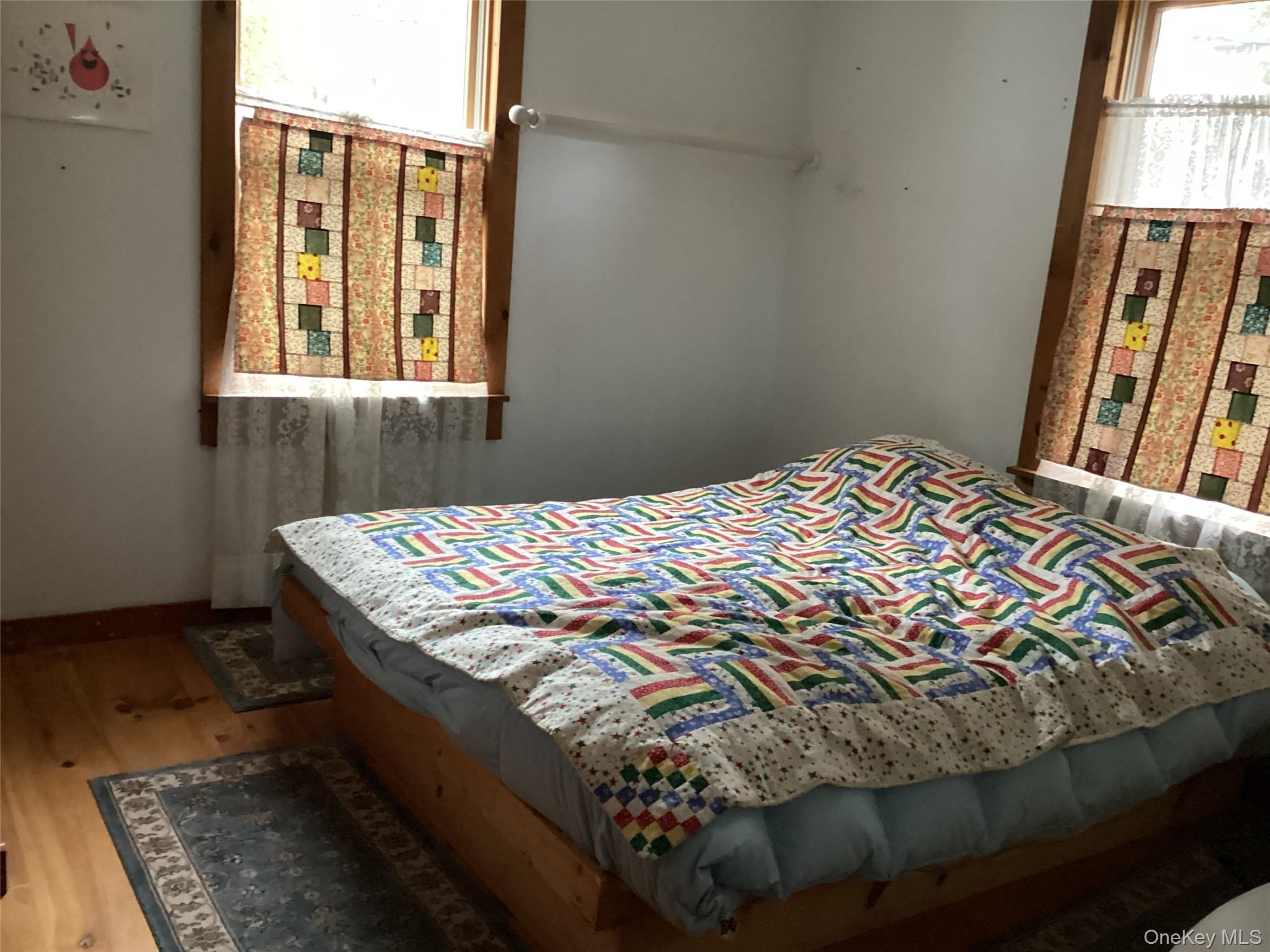 302 Todd Road, Unit T Woodbourne, NY 12788 - Photo 11 of 14 a bedroom with a bed and a window