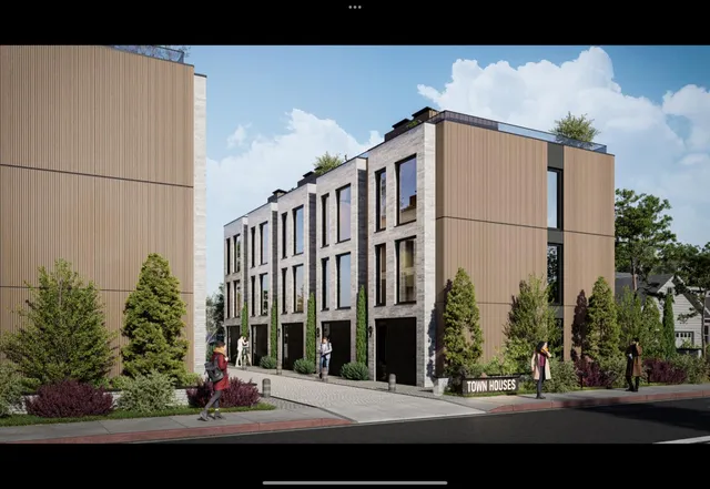 a view of a white building among the street with palm trees