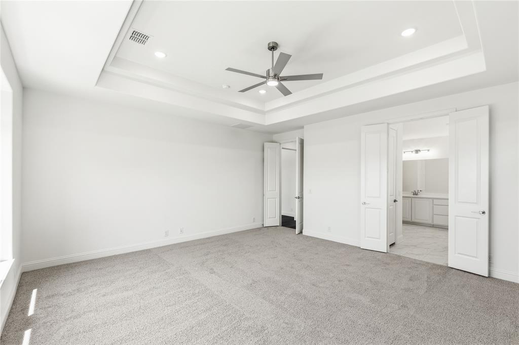 1145 Hitching Post Way Oak Point, TX 75068 - Photo 25 of 39 an empty room with closet and windows