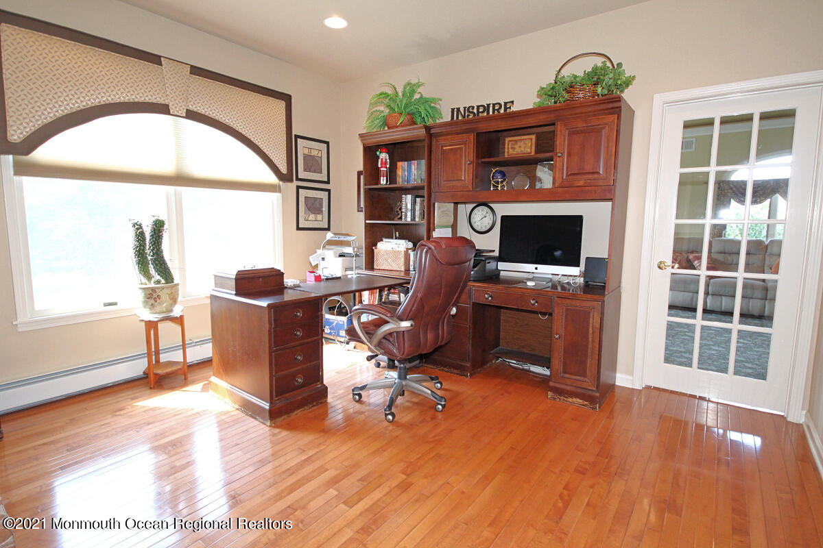 33 Maher Road Freehold, NJ 07728 - Photo 11 of 46 a view of a livingroom with furniture and a fireplace