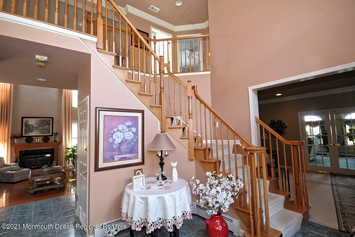 33 Maher Road Freehold, NJ 07728 - Photo 15 of 46 a view of entryway livingroom and hall with wooden floor