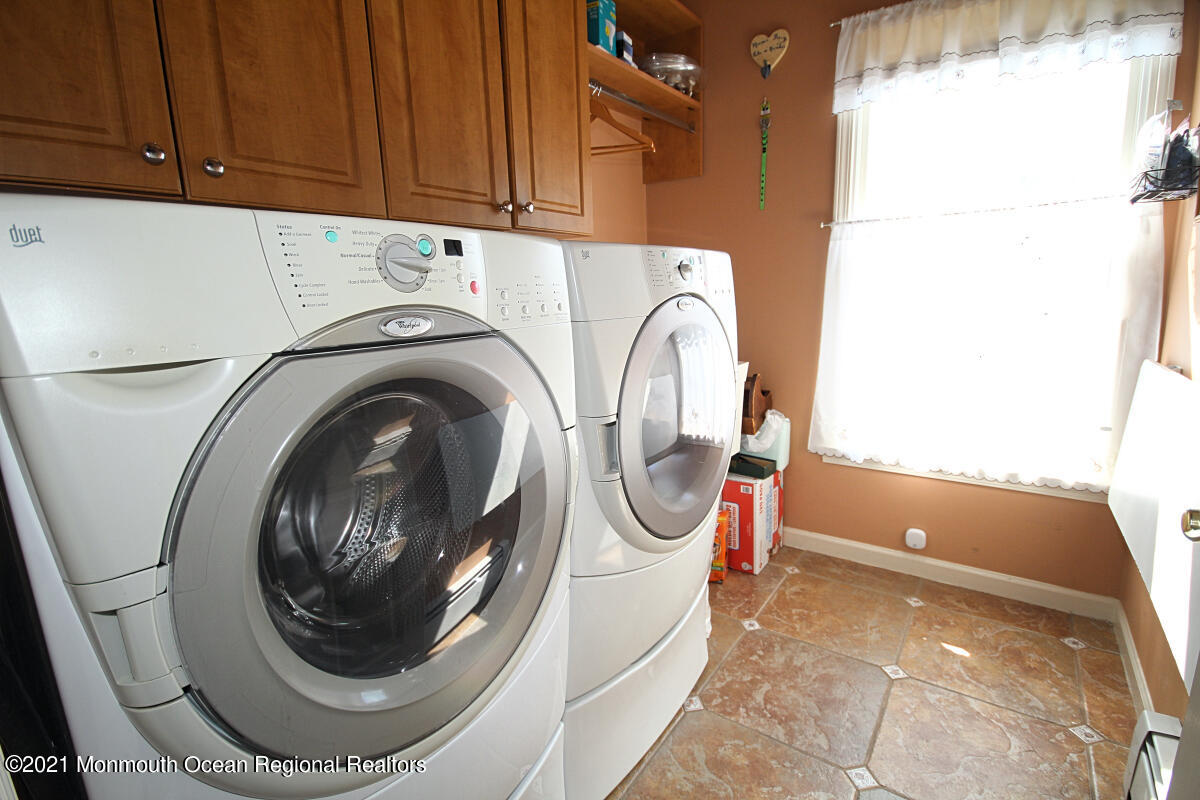 33 Maher Road Freehold, NJ 07728 - Photo 18 of 46 a utility room with dryer and washer