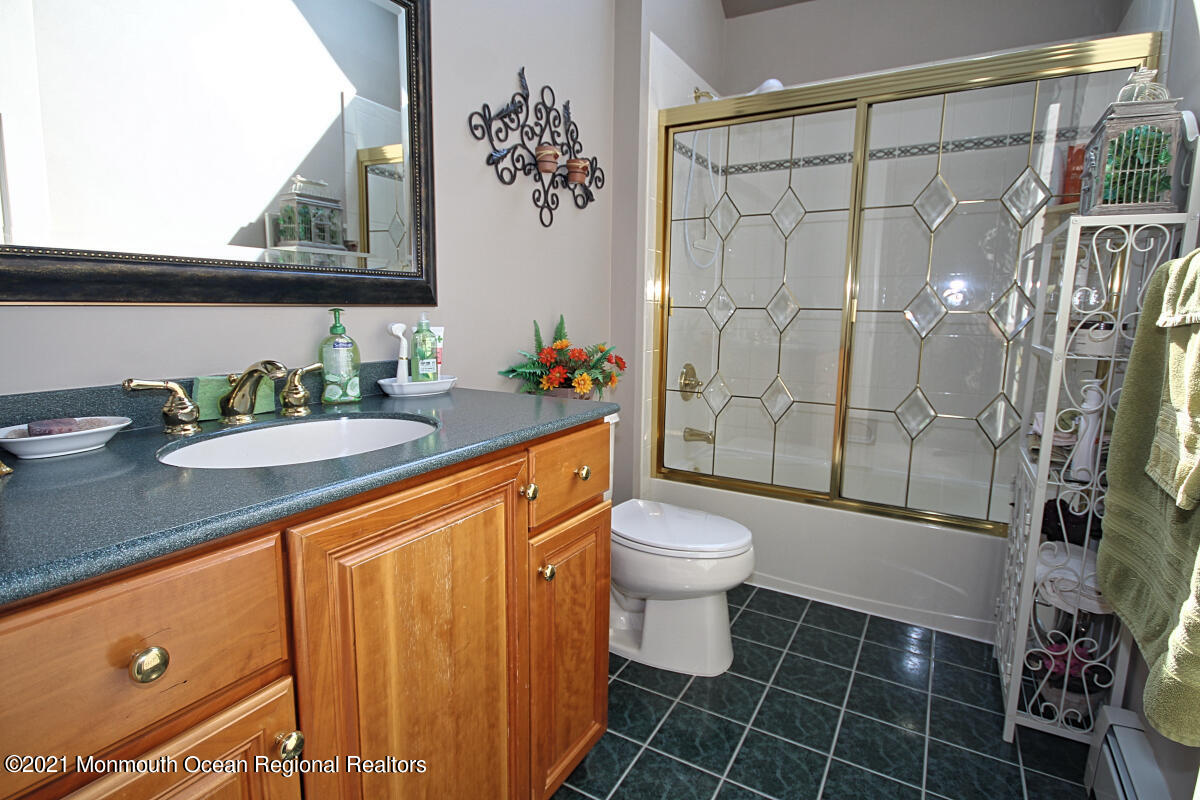 33 Maher Road Freehold, NJ 07728 - Photo 20 of 46 a bathroom with a sink a toilet and shower