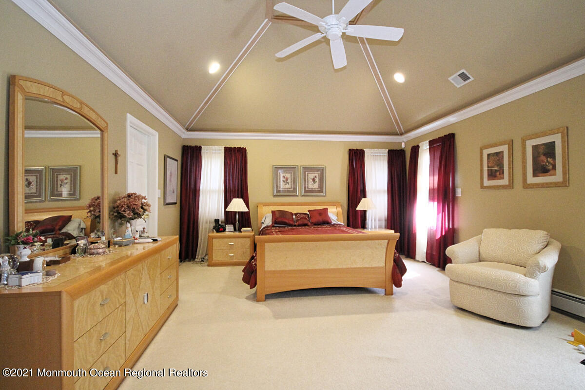 33 Maher Road Freehold, NJ 07728 - Photo 23 of 46 a living room with furniture and a chandelier