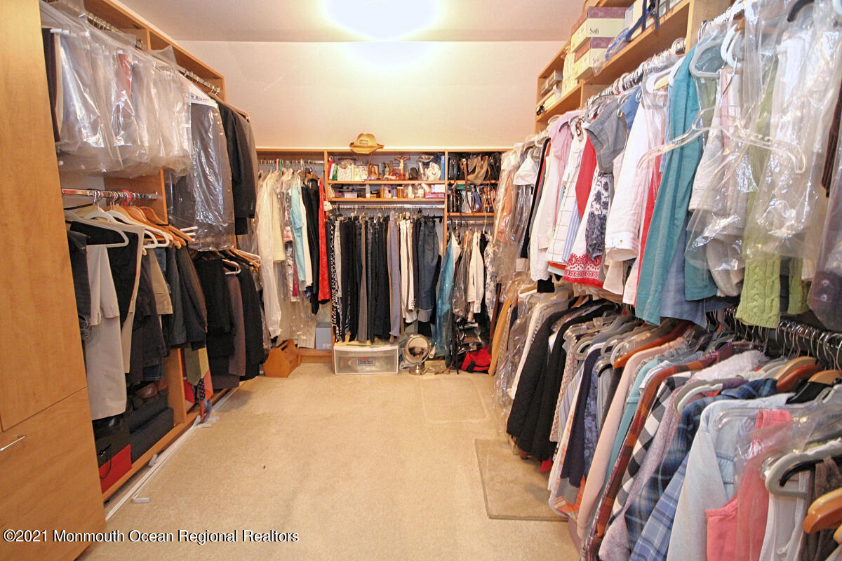33 Maher Road Freehold, NJ 07728 - Photo 26 of 46 a view of walk in closet with clothes