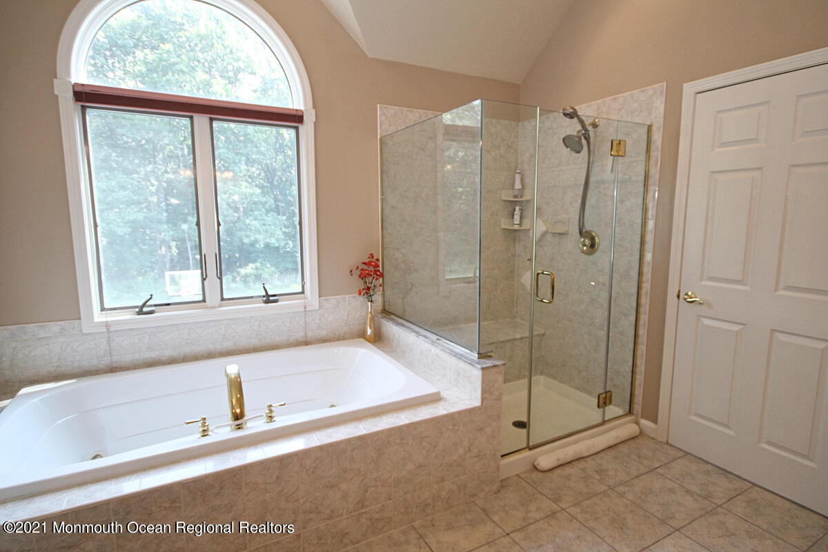 33 Maher Road Freehold, NJ 07728 - Photo 27 of 46 a bathroom with a tub shower and sink