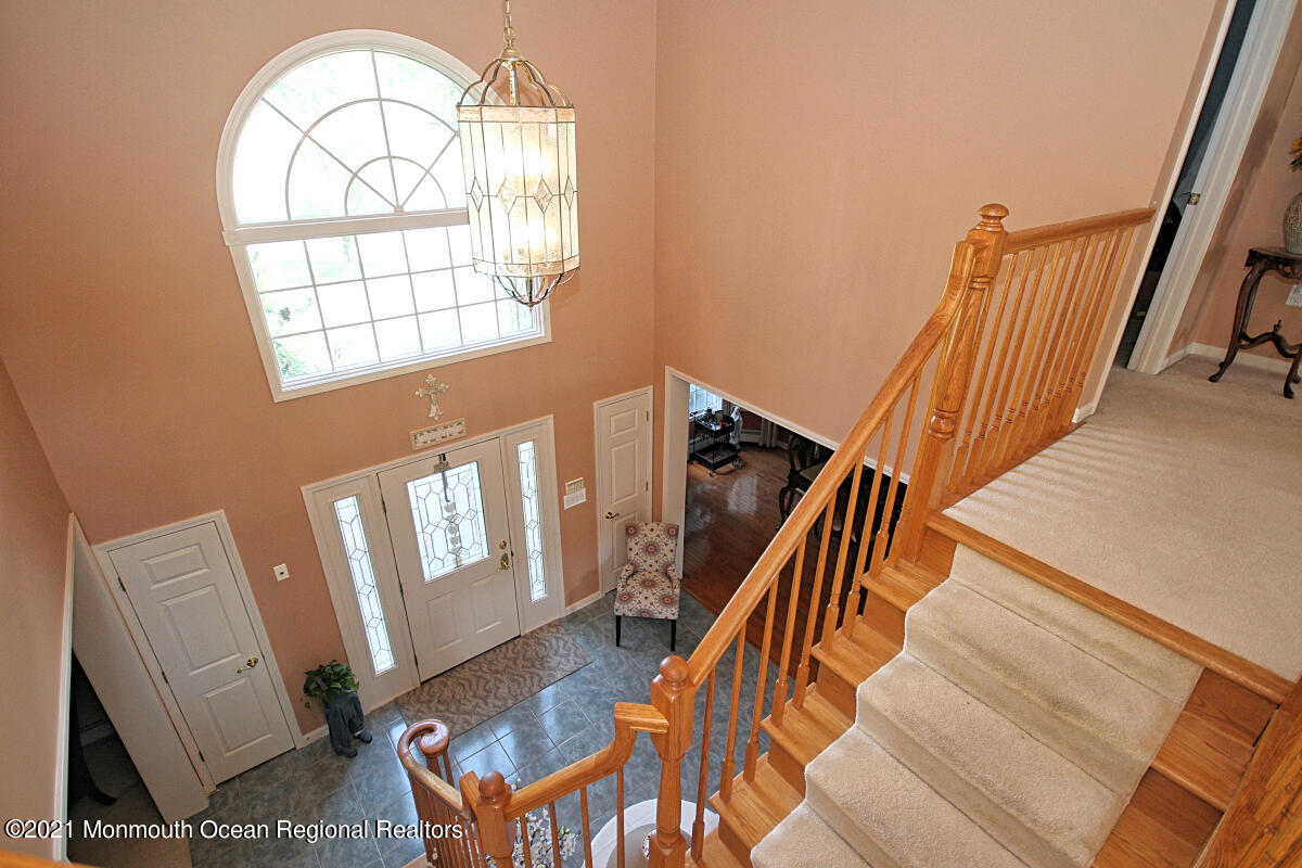 33 Maher Road Freehold, NJ 07728 - Photo 29 of 46 a view of an entryway with wooden floor and door