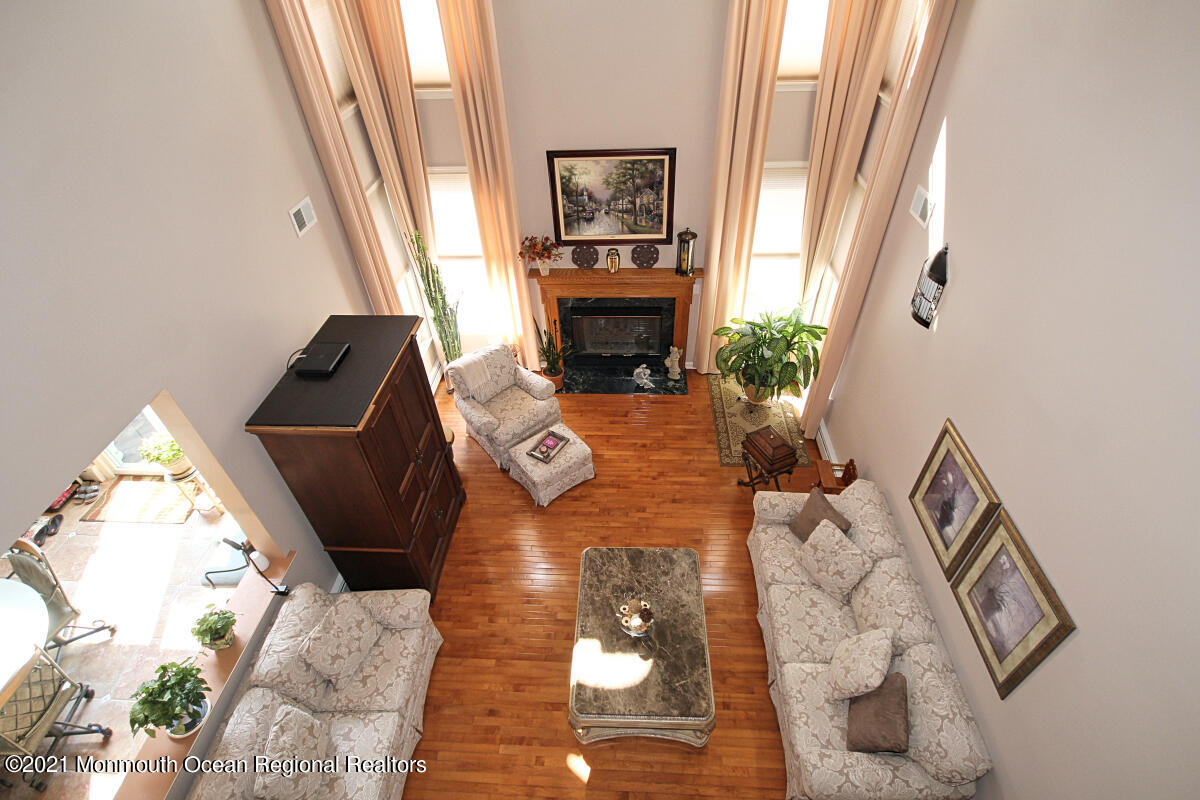 33 Maher Road Freehold, NJ 07728 - Photo 30 of 46 a living room with furniture and a fireplace