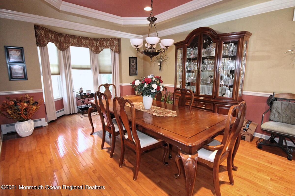 33 Maher Road Freehold, NJ 07728 - Photo 3 of 46 a view of a dining room with furniture window and wooden floor