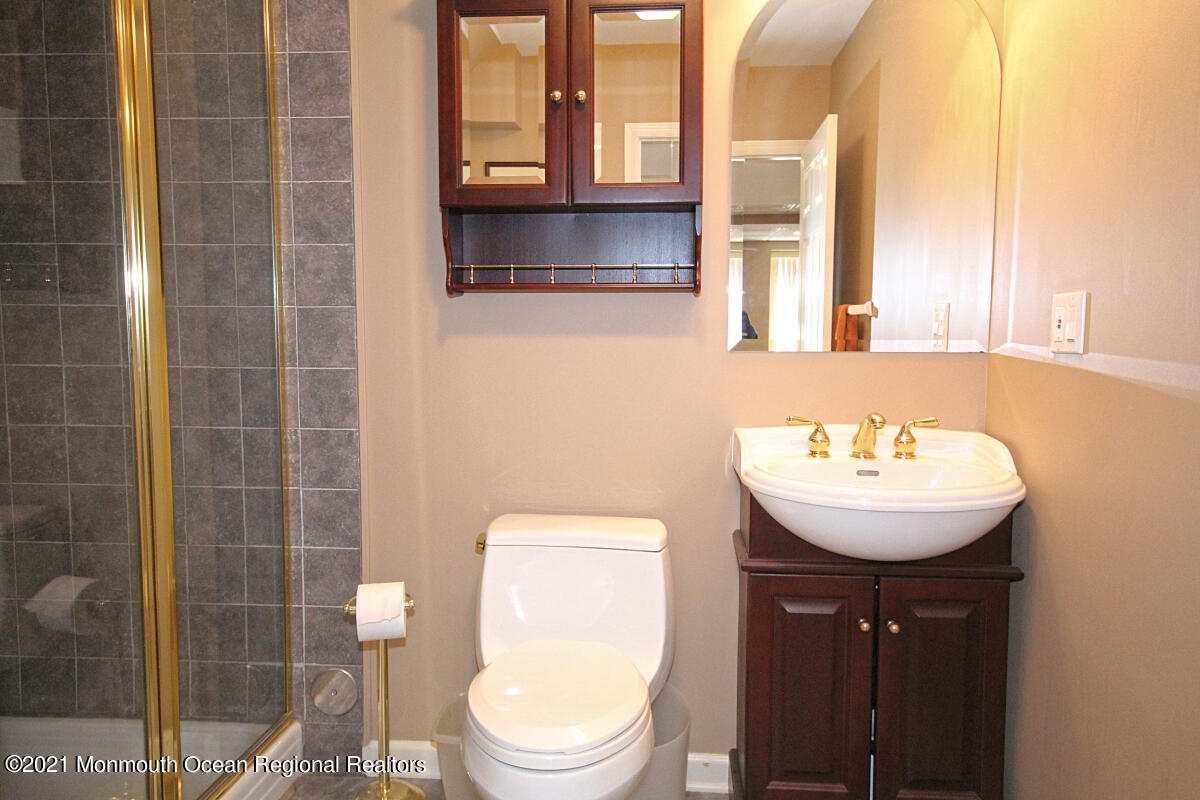33 Maher Road Freehold, NJ 07728 - Photo 35 of 46 a bathroom with a sink a toilet and shower