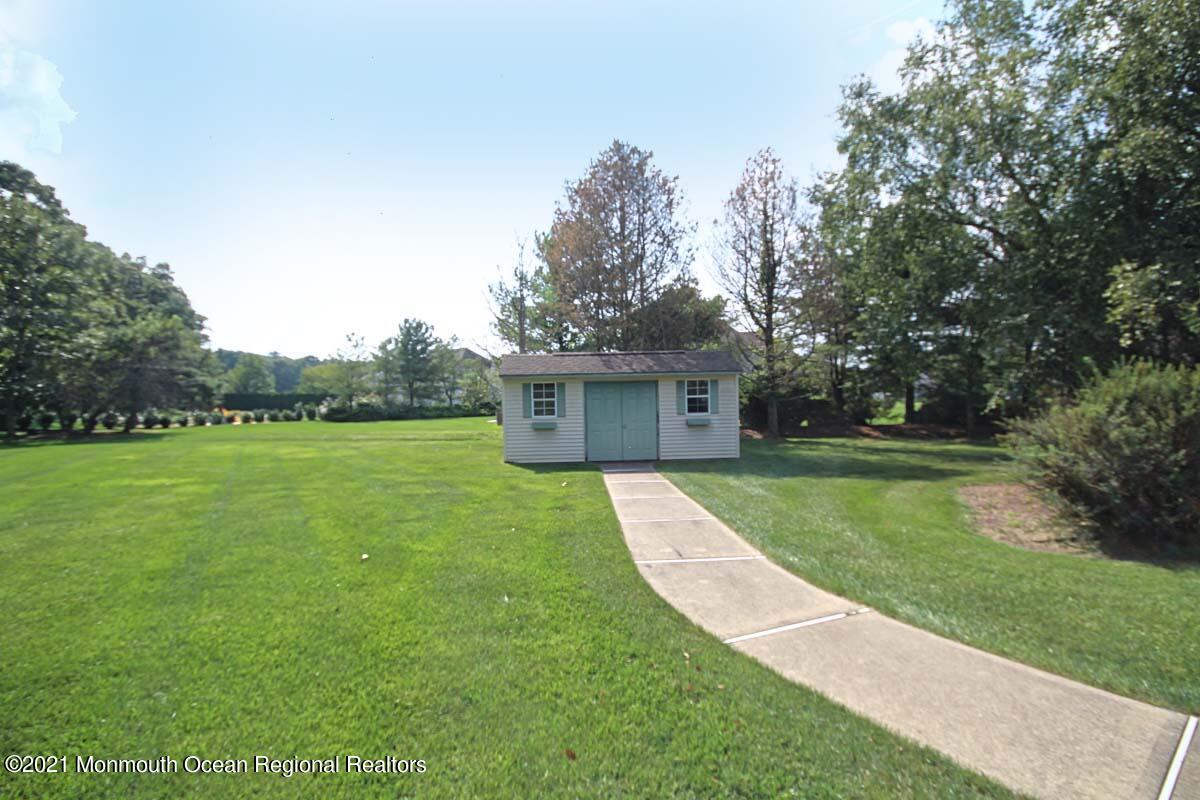 33 Maher Road Freehold, NJ 07728 - Photo 40 of 46 a front view of a house with garden