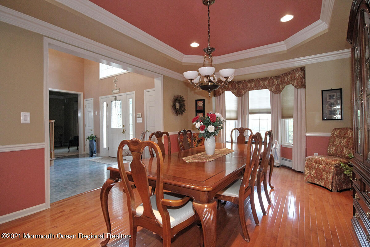 33 Maher Road Freehold, NJ 07728 - Photo 4 of 46 a view of a dining room with furniture and wooden floor