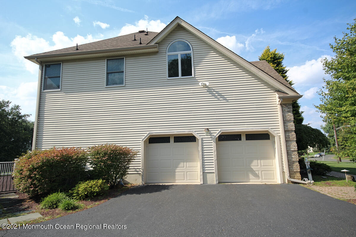33 Maher Road Freehold, NJ 07728 - Photo 44 of 46 a front view of a house with a garage