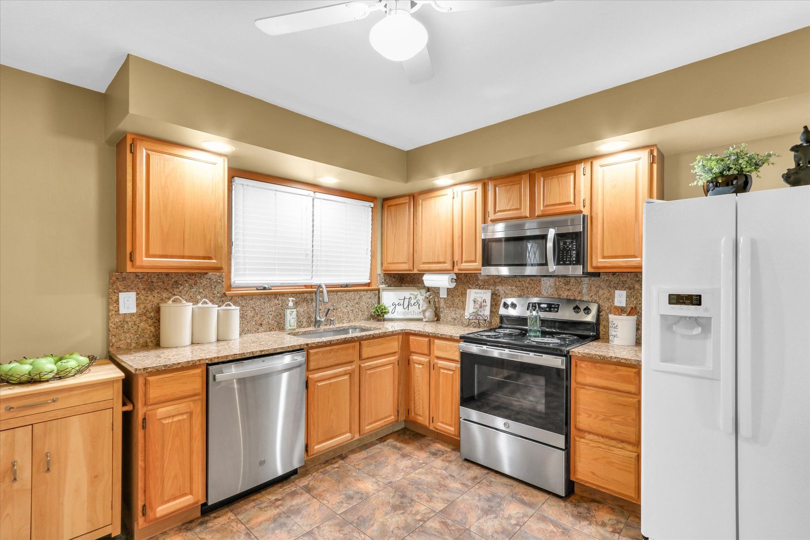 617 West John Street Champaign, IL 61820 - Photo 11 of 28 a kitchen with stainless steel appliances a stove a sink and a refrigerator
