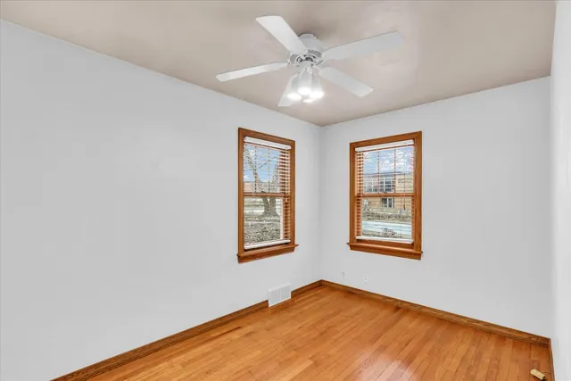 a view of an empty room with a fireplace
