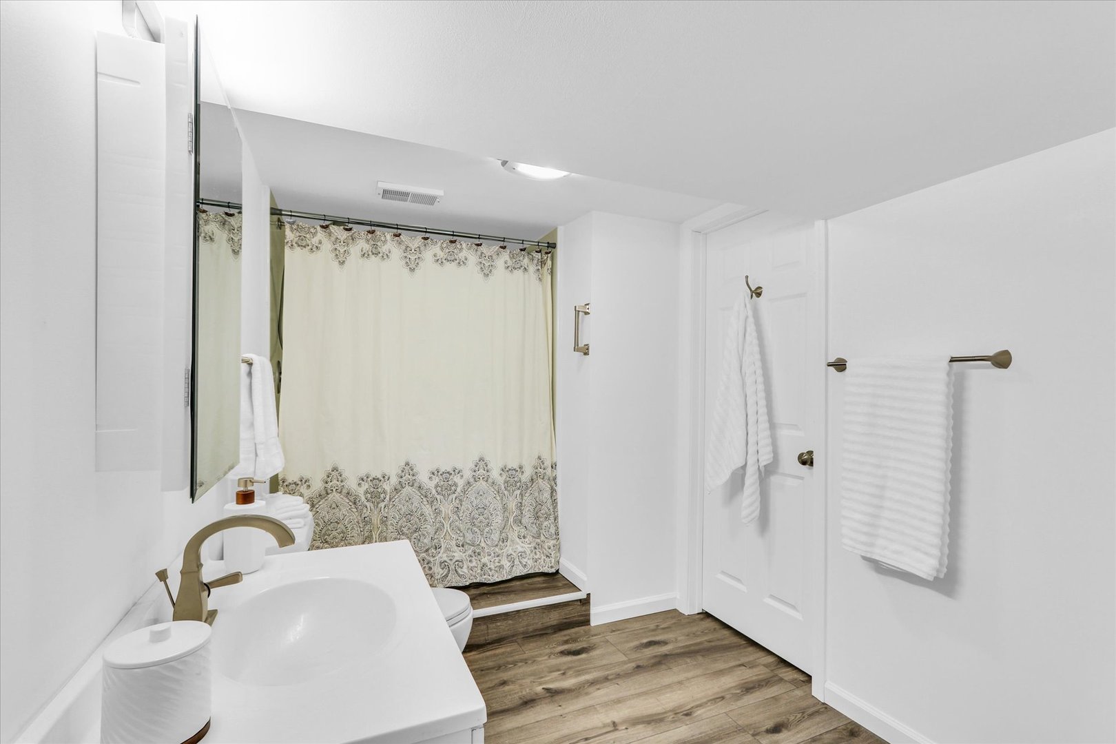 617 West John Street Champaign, IL 61820 - Photo 22 of 28 a bathroom with a sink and a mirror