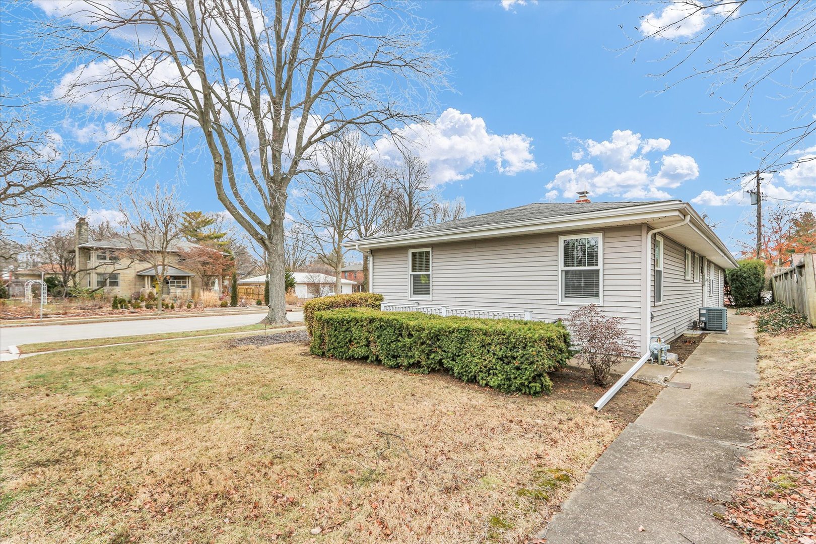 617 West John Street Champaign, IL 61820 - Photo 25 of 28 a front view of a house with garden