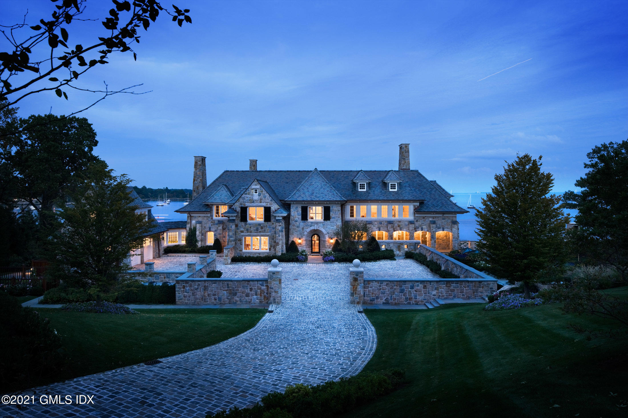 100 Field Point Circle Greenwich, CT 06830 - Photo 9 of 9 a front view of a house with garden
