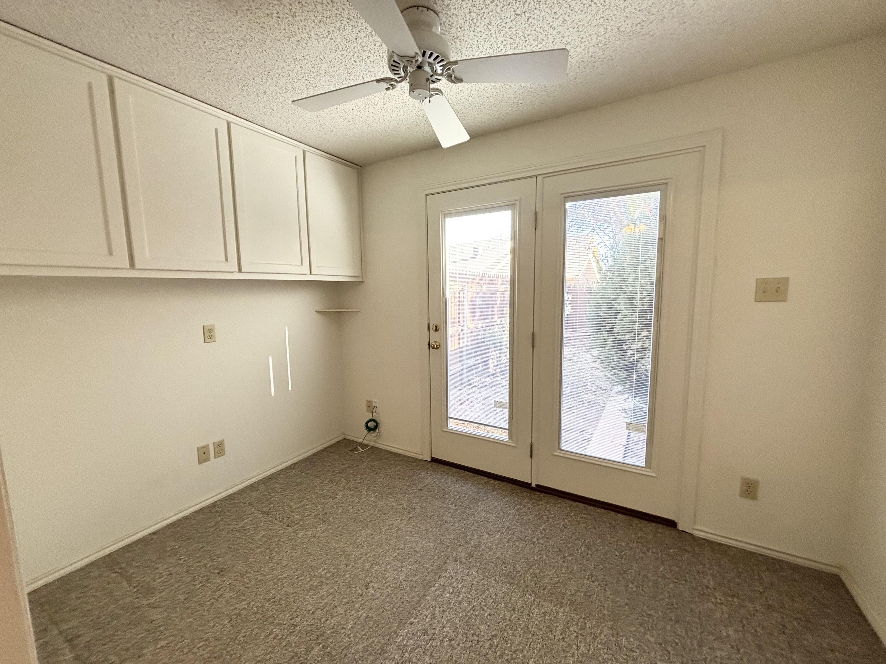 6705 Fulton Avenue Lubbock, TX 79424 - Photo 12 of 18 an empty room with windows