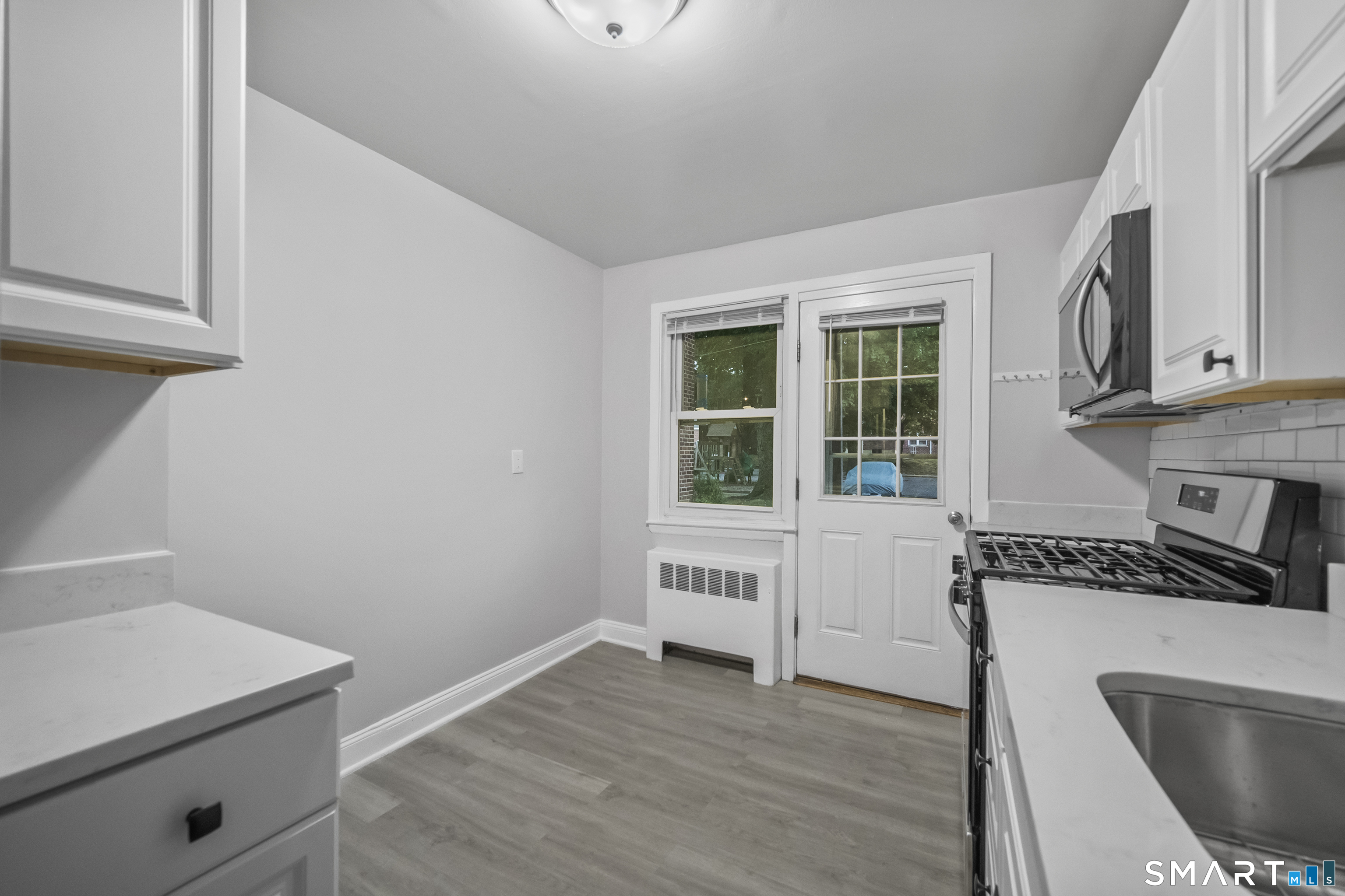 66 Blachley Road, Unit D Stamford, CT 06902 - Photo 5 of 34 Photos are of another unit that is a mirror image of this layout. Finishes may vary.